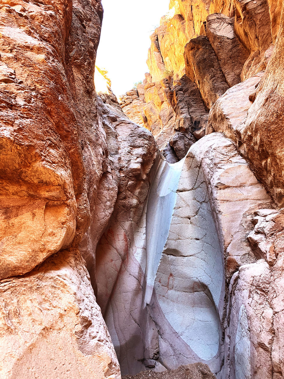 rock, rock formation, canyon, nature, geology, wadi, beauty in nature, non-urban scene, scenics - nature, travel destinations, no people, arch, eroded, physical geography, travel, day, tranquility, sandstone, outdoors, land, extreme terrain, environment, terrain, landscape, formation, sunlight, cliff, tranquil scene, desert, idyllic, low angle view, tourism