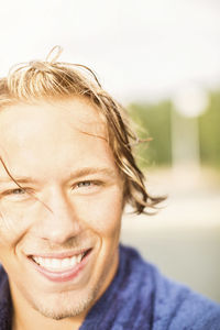 Close-up portrait of a smiling young man