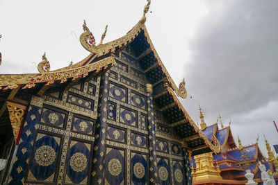 Low angle view of temple against building