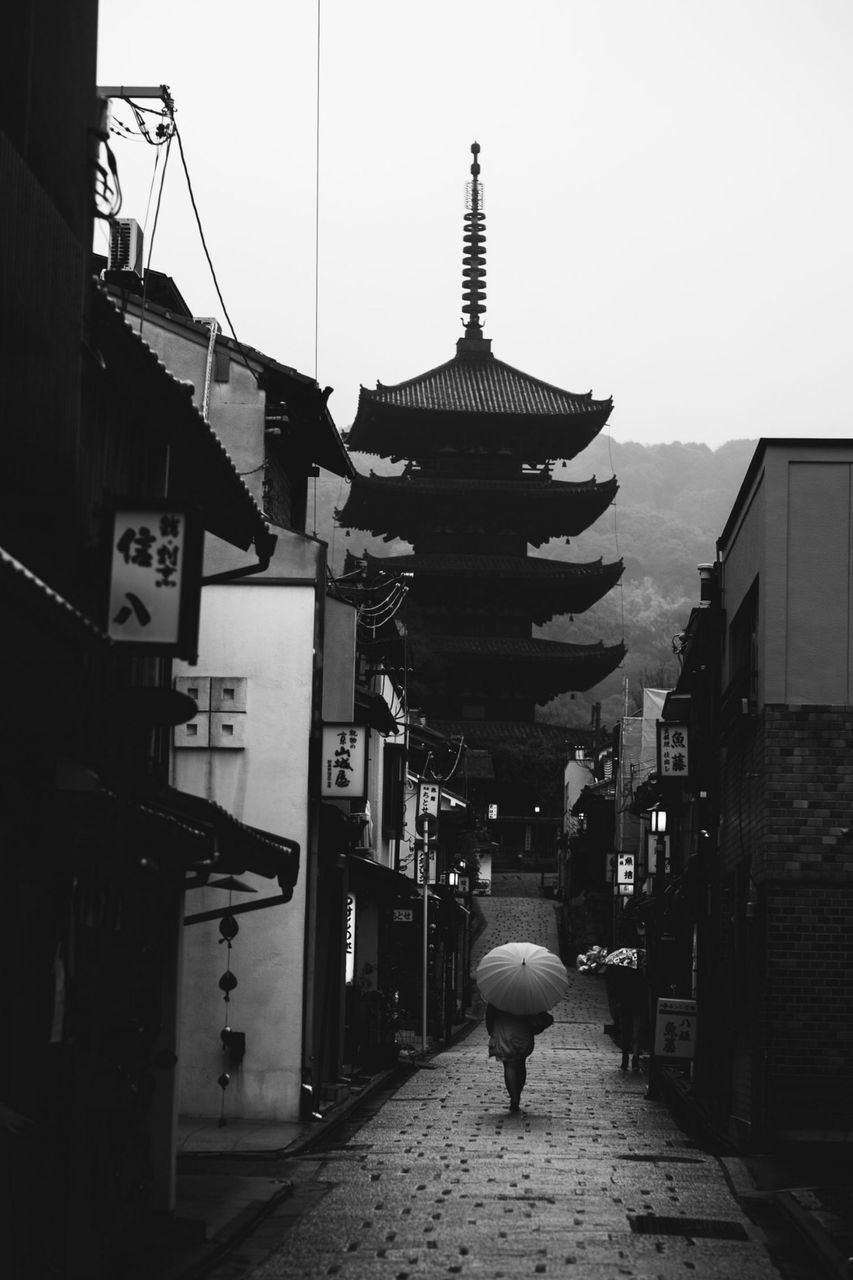 architecture, built structure, building exterior, the way forward, men, walking, religion, person, rear view, lifestyles, place of worship, spirituality, street, clear sky, incidental people, day, outdoors, full length