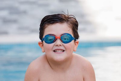 Portrait of shirtless boy in sea