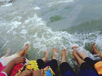 Low section of people by sea