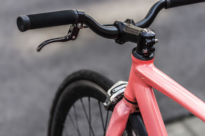 Cropped image of bicycle on street