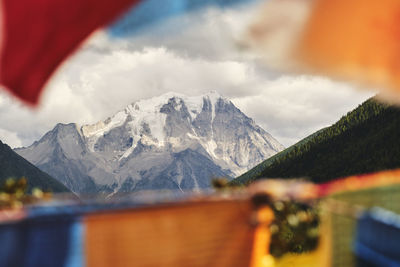 Scenic view of snowcapped mountains against sky