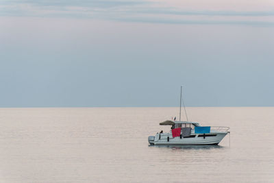 Boat in sea against sky