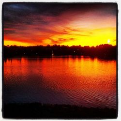 Scenic view of lake at sunset