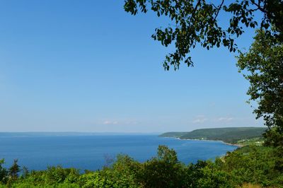 Scenic view of sea against blue sky