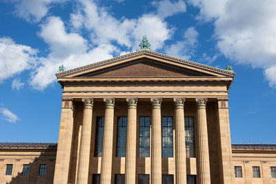 Low angle view of historical building against cloudy sky