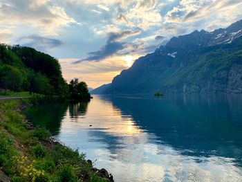 Scenic view of lake against sky during sunset