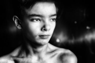 Close-up portrait of shirtless boy