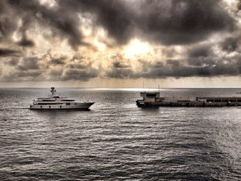 Scenic view of sea against cloudy sky