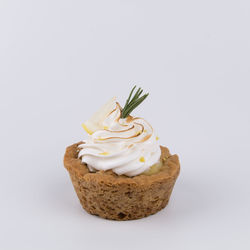 Close-up of cake against white background