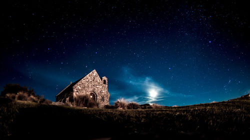 Low angle view of building against sky at night