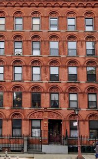 Frontal view of building facade of red brick
