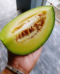 Close-up of hand holding fruit