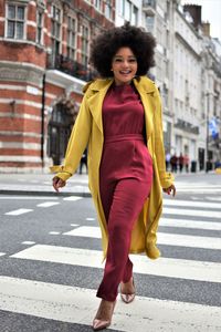 Portrait of smiling young woman on street