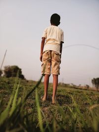 Boy stand in golf practice club