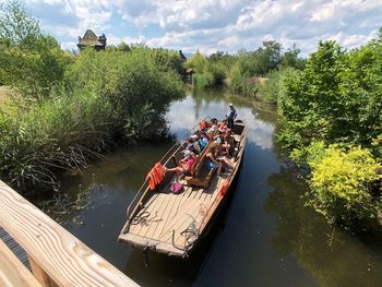 High angle view of boats in river against trees