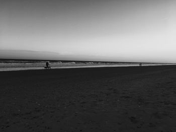 Scenic view of beach against clear sky