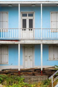 Vintage old house in athens greece with a second floor.showing white old wooden doors and windows.