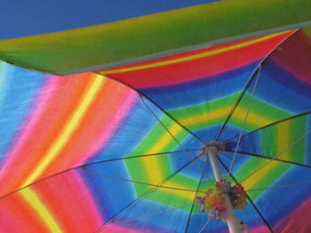 Low angle view of colorful umbrella against clear sky