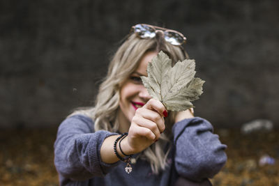 Close-up portrait of woman holding ice cream