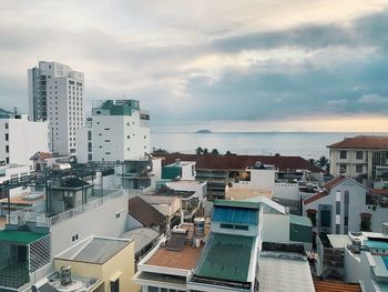 High angle view of buildings in city against sky