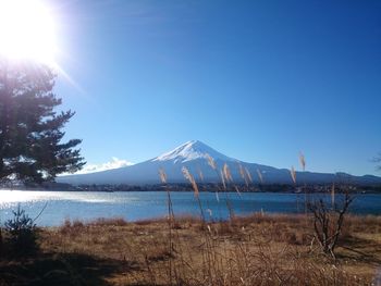 Scenic view of mountains against clear blue sky