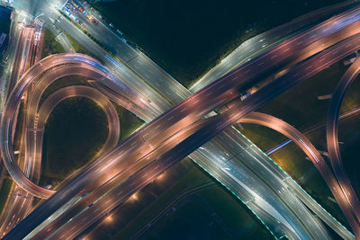 High angle view of light trails on highway at night