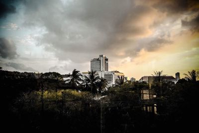 View of buildings against cloudy sky