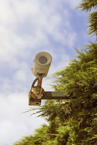 Low angle view of information sign against sky