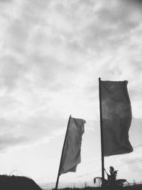 Low angle view of flag against sky