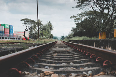 Surface level of railroad tracks against sky