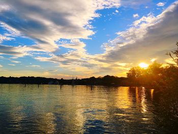 Scenic view of lake against sky during sunset