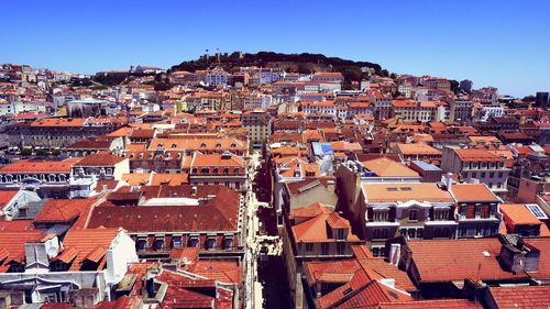 High angle view of townscape against clear blue sky