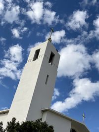 Low angle view of church belltower  against sky
