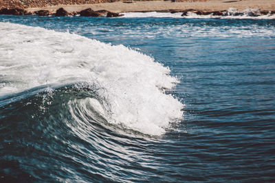 Wave in river on sunny day