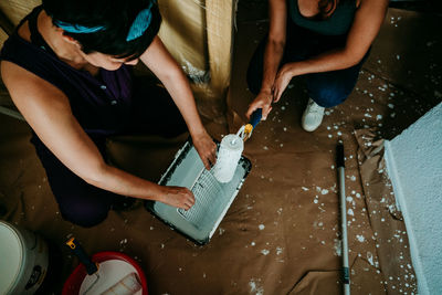 High angle view of women painting at home