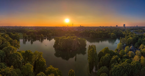 Scenic view of lake against sky during sunset