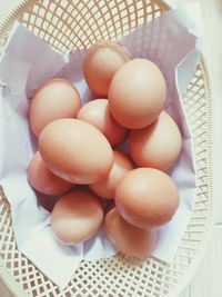 High angle view of eggs in basket on table