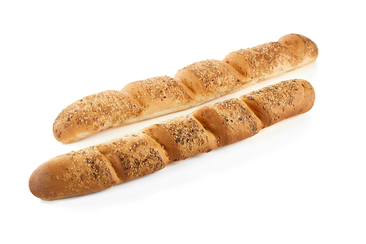 CLOSE-UP OF BREAD AGAINST WHITE BACKGROUND