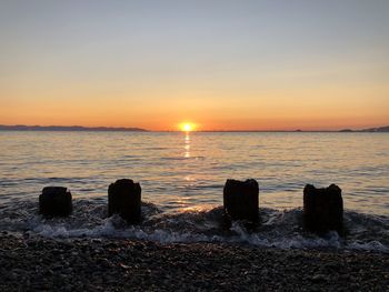 Scenic view of sea against sky during sunset