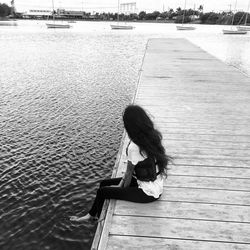 Full length of woman standing in water