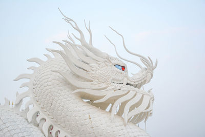 White chinese dragon decorated on a chinese dragon sculpture design background