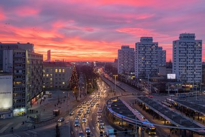 High angle view of traffic on city street at sunset