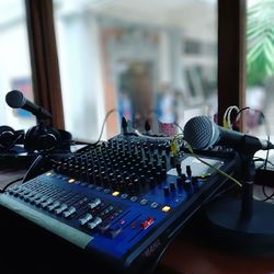 Close-up of microphones with sound mixer