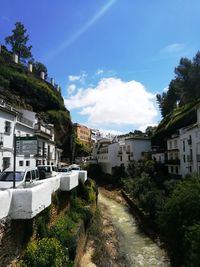 Buildings in town against sky