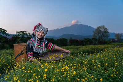 Portrait of smiling woman on field