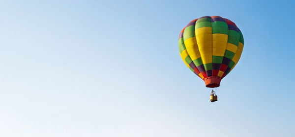 Low angle view of hot air balloon against clear sky