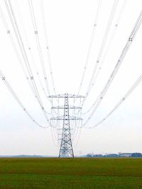 Electricity pylon on field